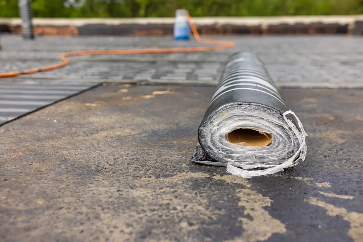Roll of SBS modified bitumen membrane laid out on a Calgary flat roof