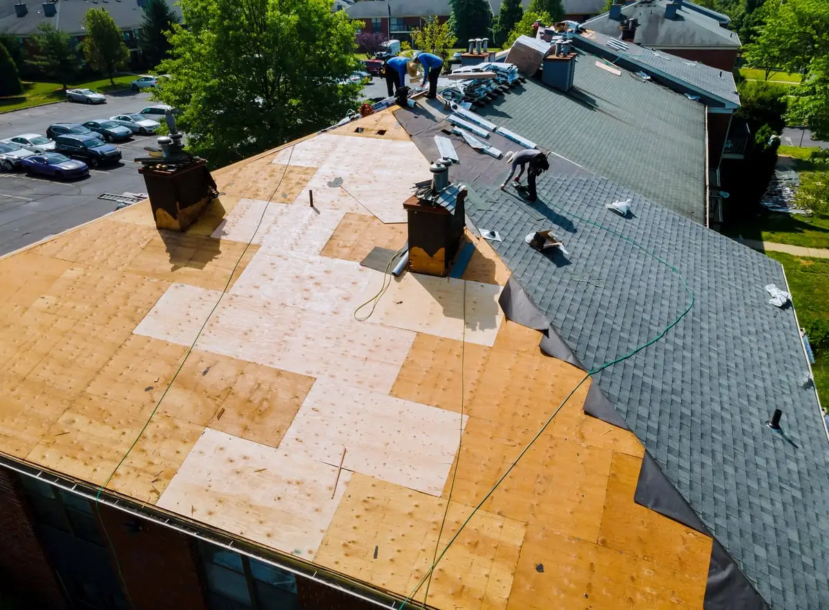 Aerial view of a Calgary roof replacement in progress with fresh underlayment down